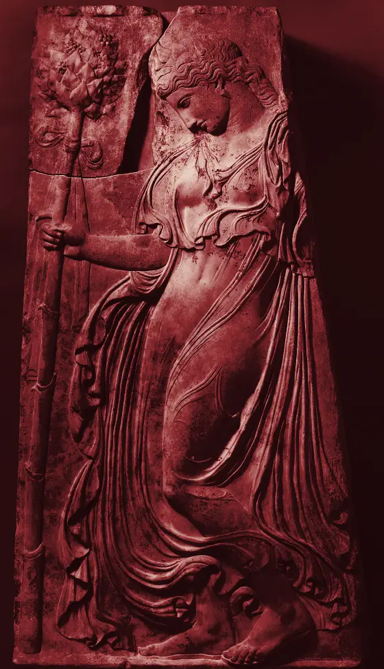 Marble relief of a maenad dancing with a thyrsus
